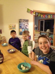 Joe with this friends, enjoying the make-your-own sundae bar. (Joe will tell you - he's not a "cake guy.")